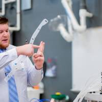 Student explaining how their project works